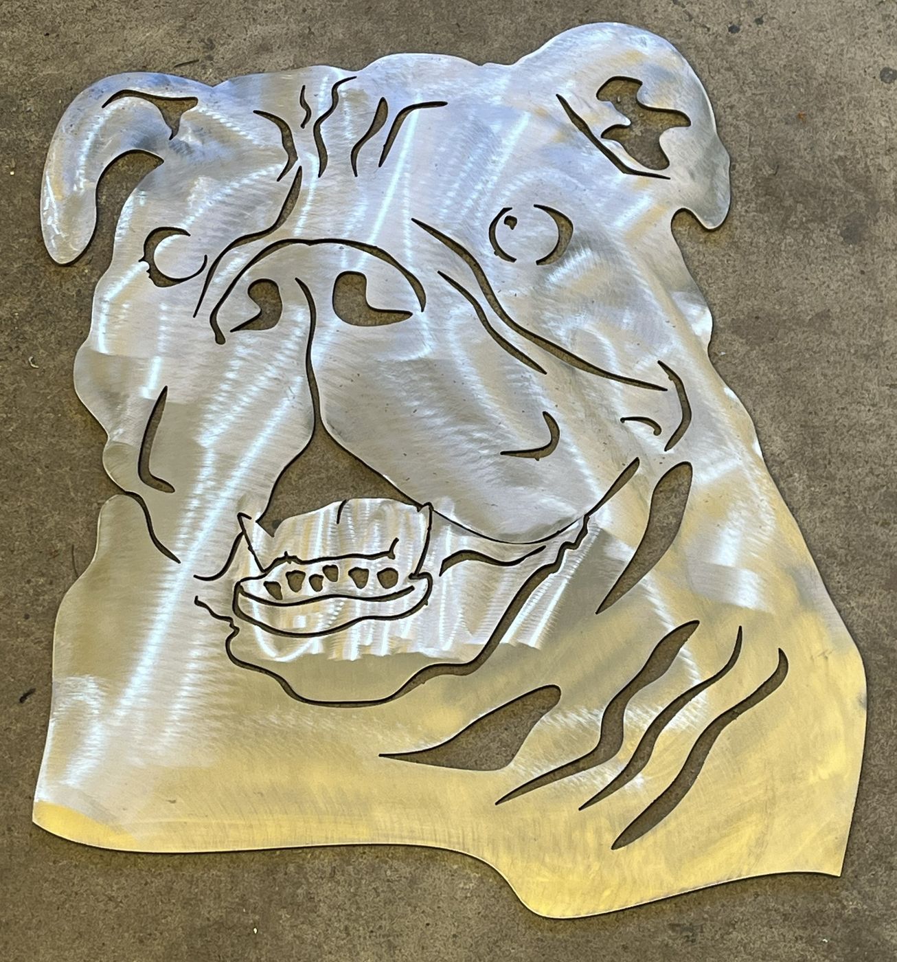 Plasma-cut bulldog wall art in brushed raw steel