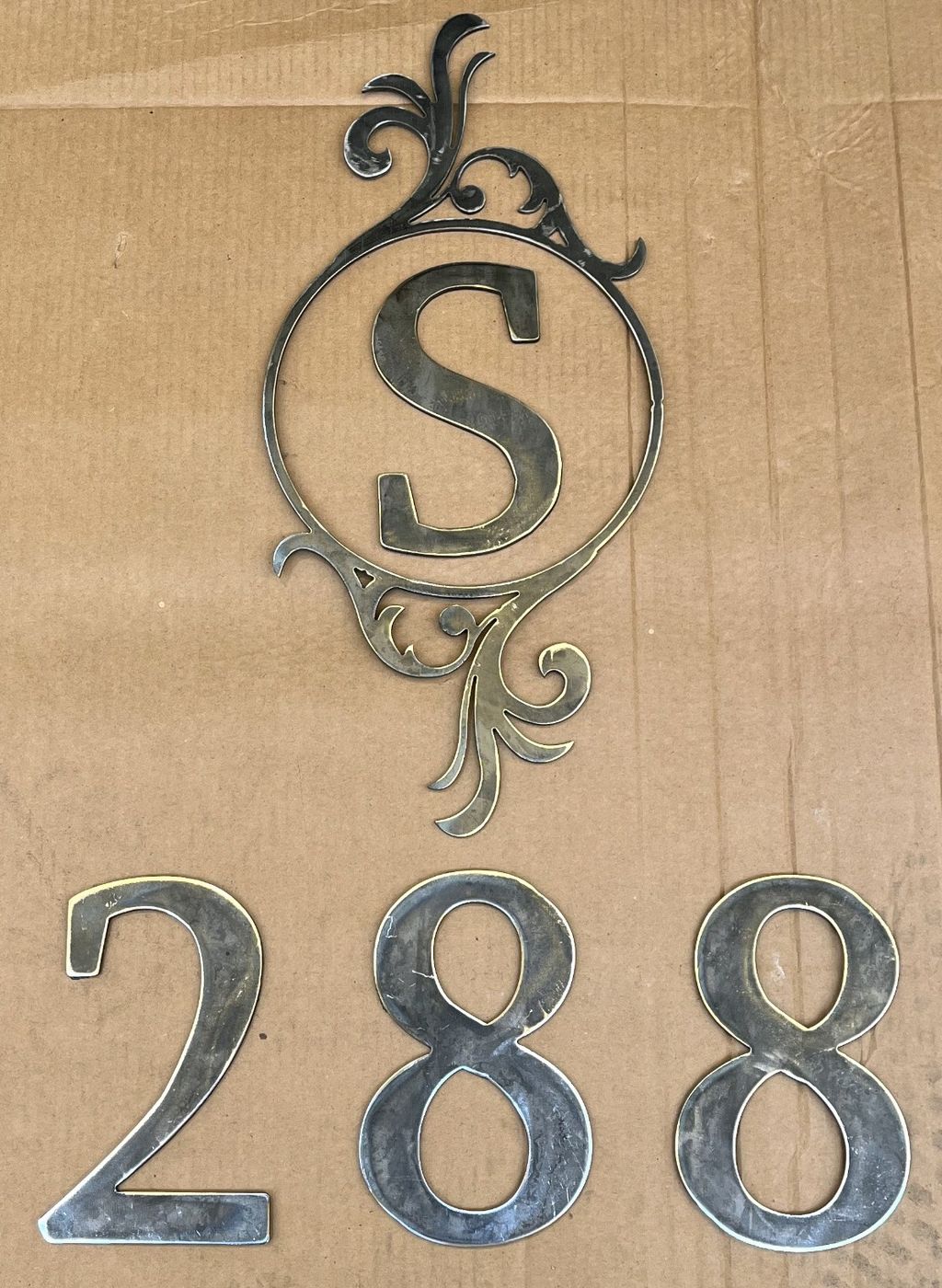 Plasma-cut S monogram with scrollwork and separate house numbers