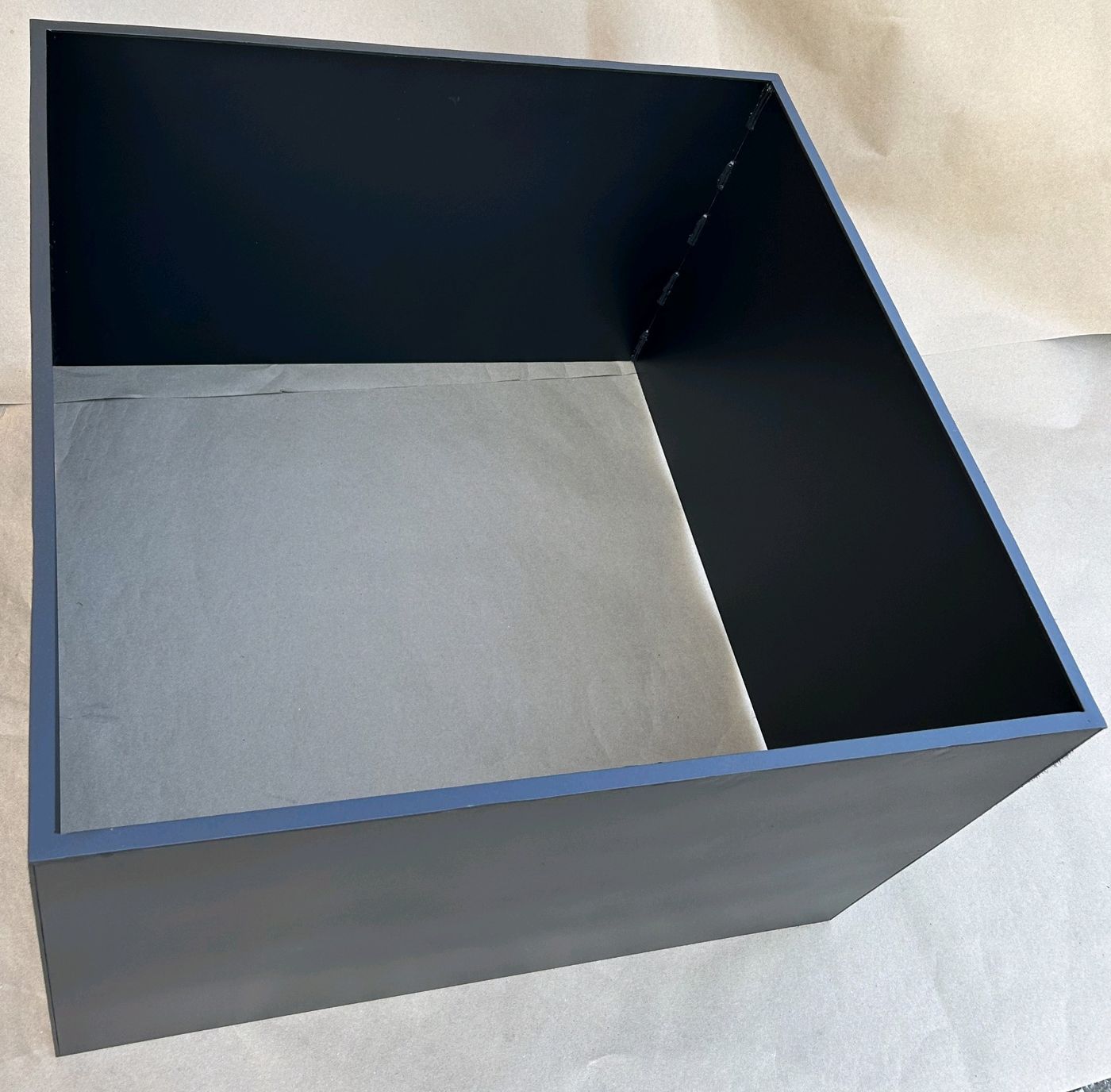 Large gray powder-coated open-top steel bin