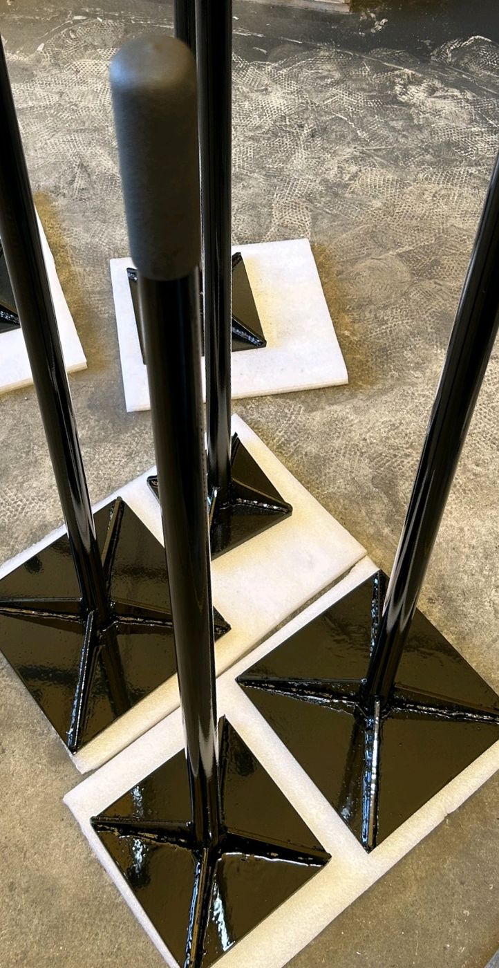 Custom hand tampers with welded heads and tubular handles in gloss black